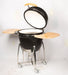 Black ceramic kamado-style BBQ with dome lid and steel frame on wheels