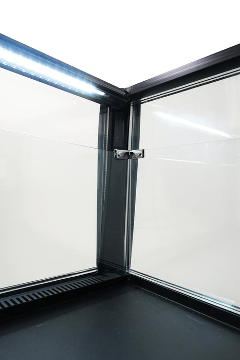 Black countertop refrigerated display island with straight glass front and LED lighting view 7
