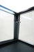 Black countertop refrigerated display island with straight glass front and LED lighting view 7