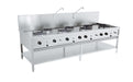 Stainless steel gas wok table with seven burners, freestanding model.