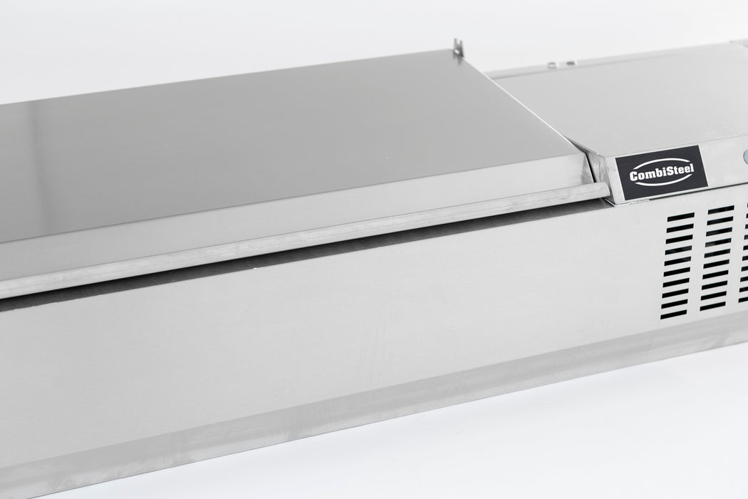 Stainless steel refrigerated countertop with recessed pan wells and sliding bar access. view 3