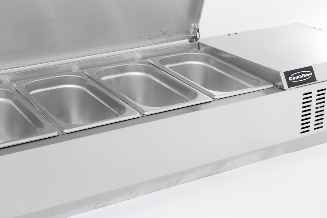 Stainless steel refrigerated countertop with recessed pan wells and sliding bar access. view 5