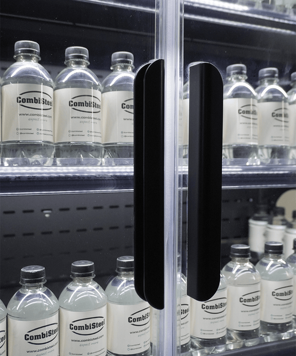 Black wall mounted four door refrigerated display case with LED lit interior and five shelves view 4