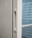White single glass door upright freezer with LED lighting and five wire shelves view 5