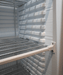 White single glass door upright freezer with LED lighting and five wire shelves view 7