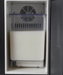 Black and stainless steel countertop milk cooler with integrated container and 7mm milk outlet. view 6
