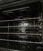 Stainless steel compact convection oven with left-hinge door and wire shelves visible inside view 5