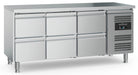 Stainless steel refrigerated counter with six pull-out drawers and adjustable feet